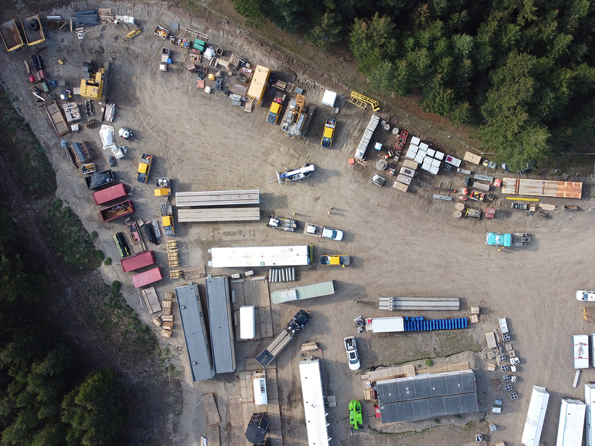 Equipment being temporarily stockpiled prior to demobilization as surrounding wildfires and the recent mudslide limited movement of materials.